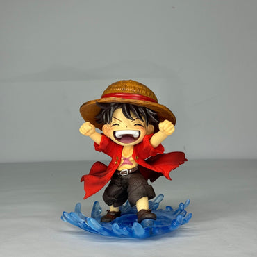 A close-up on the face of the Luffy figure, capturing his signature big laugh and the quality of the paintwork.