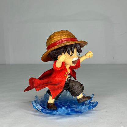 An angled view of the Monkey D. Luffy laughing statue, highlighting the dynamic details of his pose and the Water Moon style.