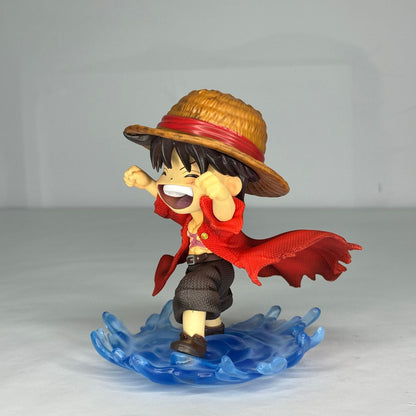 Detailed shot of the Laughing Luffy figure, showing the back of his Straw Hat and the texture of his red vest.